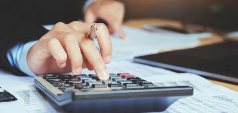 Small business accounting team reviewing financial data