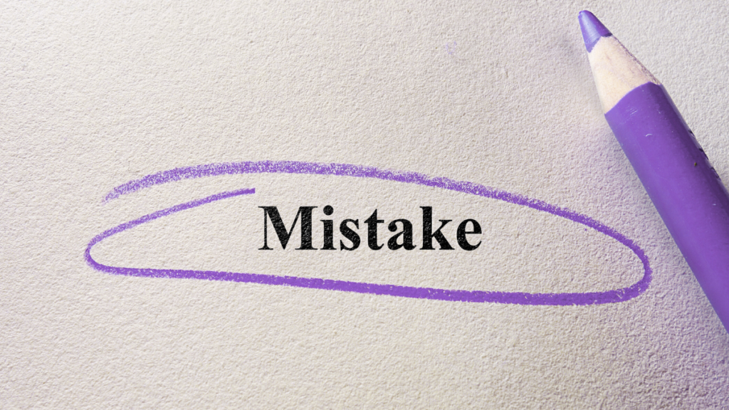 Word “Mistake” circled with a purple pencil