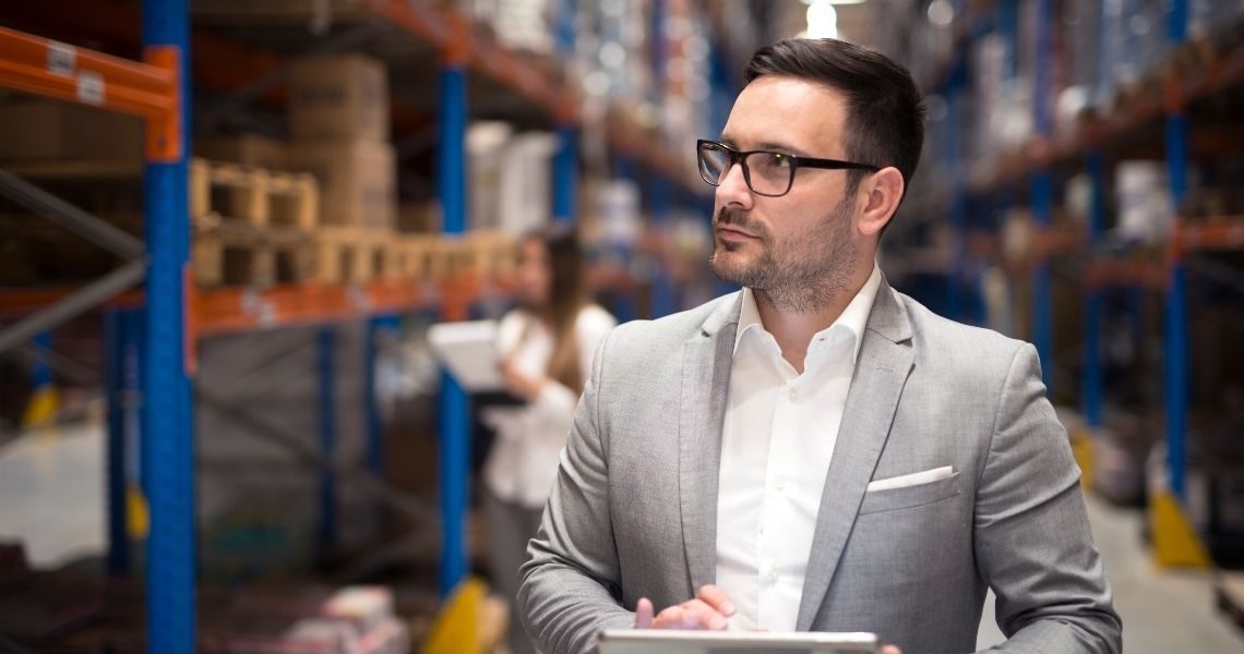 Retail manager reviewing inventory