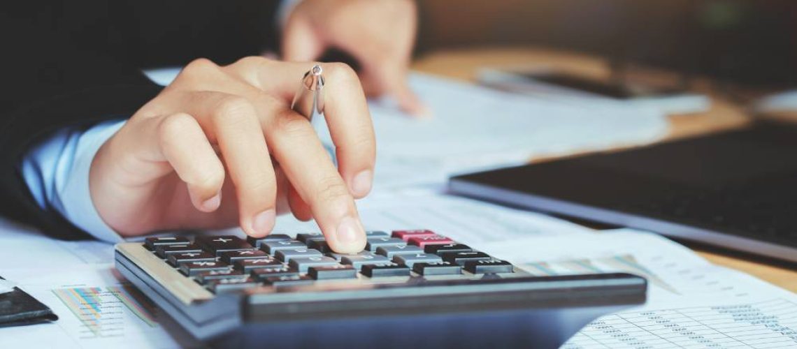 Small business accounting team reviewing financial data